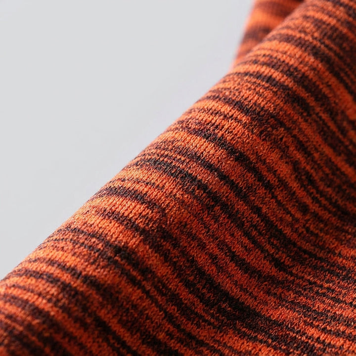Close-up of quick-drying fabric on men's athletic outfit, showing texture