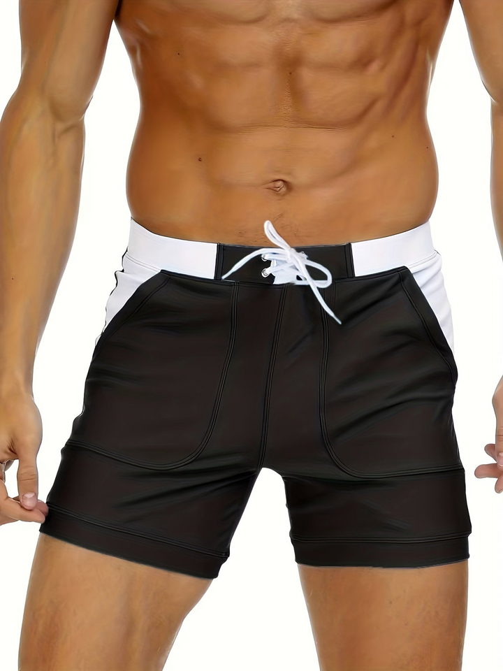 Stylish quick-dry men's swim shorts for summer and water sports, breathable design.