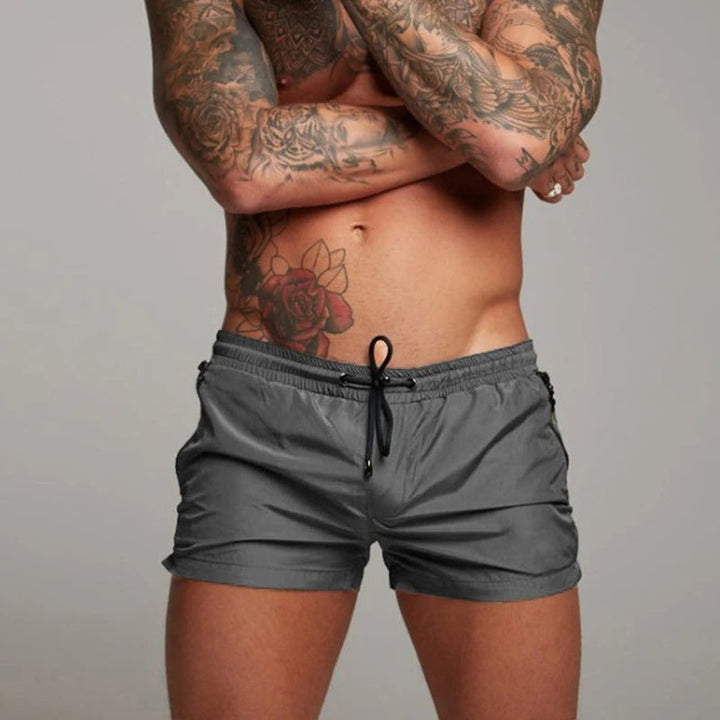 Performance men's quick-drying stretch swim shorts, offering comfort & freedom for active beach days.