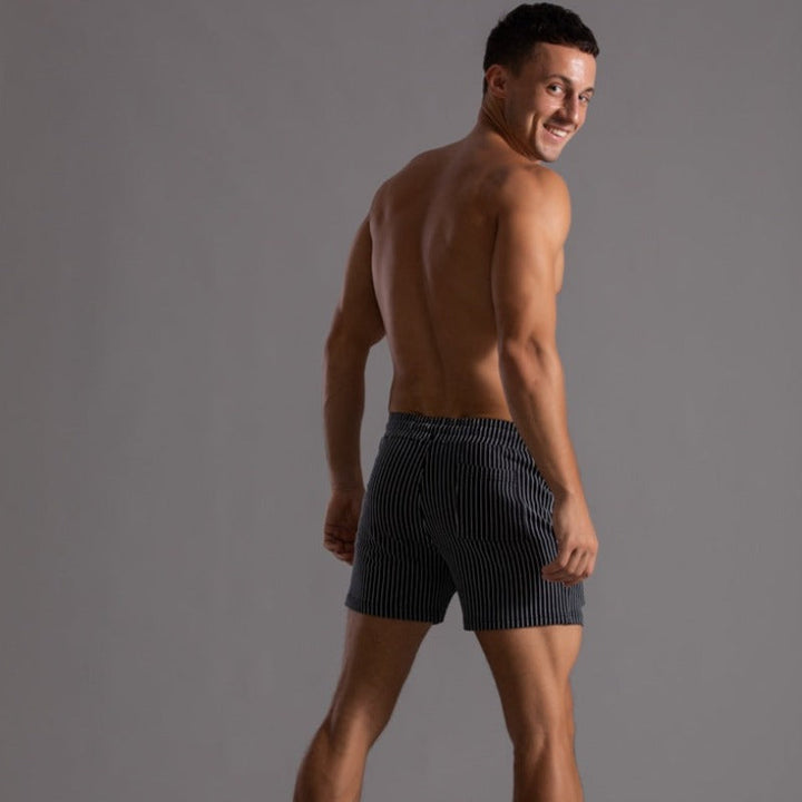 Comfortable men's quick-drying swim shorts in ripstop polyester, ideal for any summer adventure.