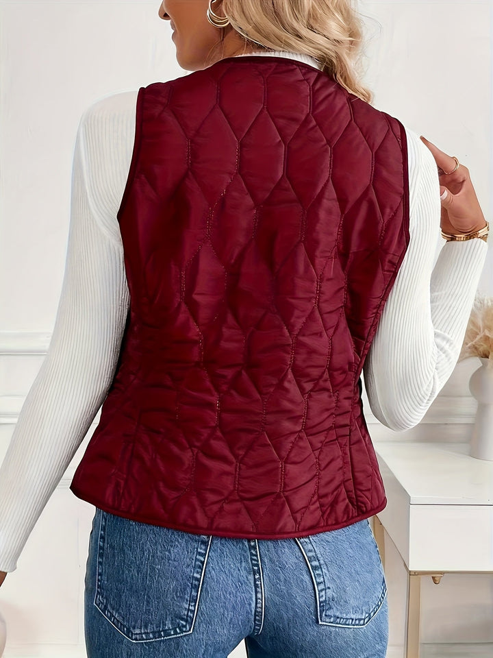 Men's quilted bomber vest with sherpa lining, shown layered. A warm and versatile piece for winter outerwear.