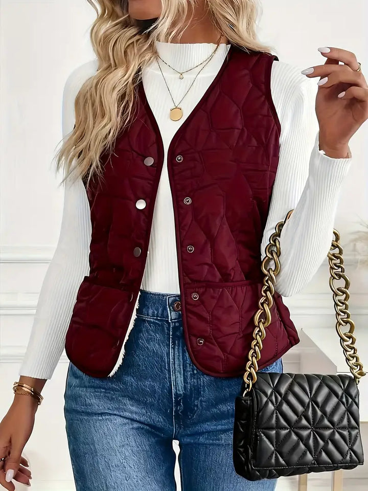 Warm men's casual quilted bomber vest with soft sherpa lining. Stylish outerwear for comfortable winter layering.