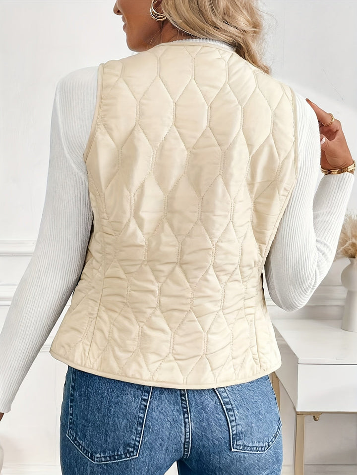 Model wears a men's casual quilted bomber vest with sherpa lining. Ideal for everyday winter layering & warmth.