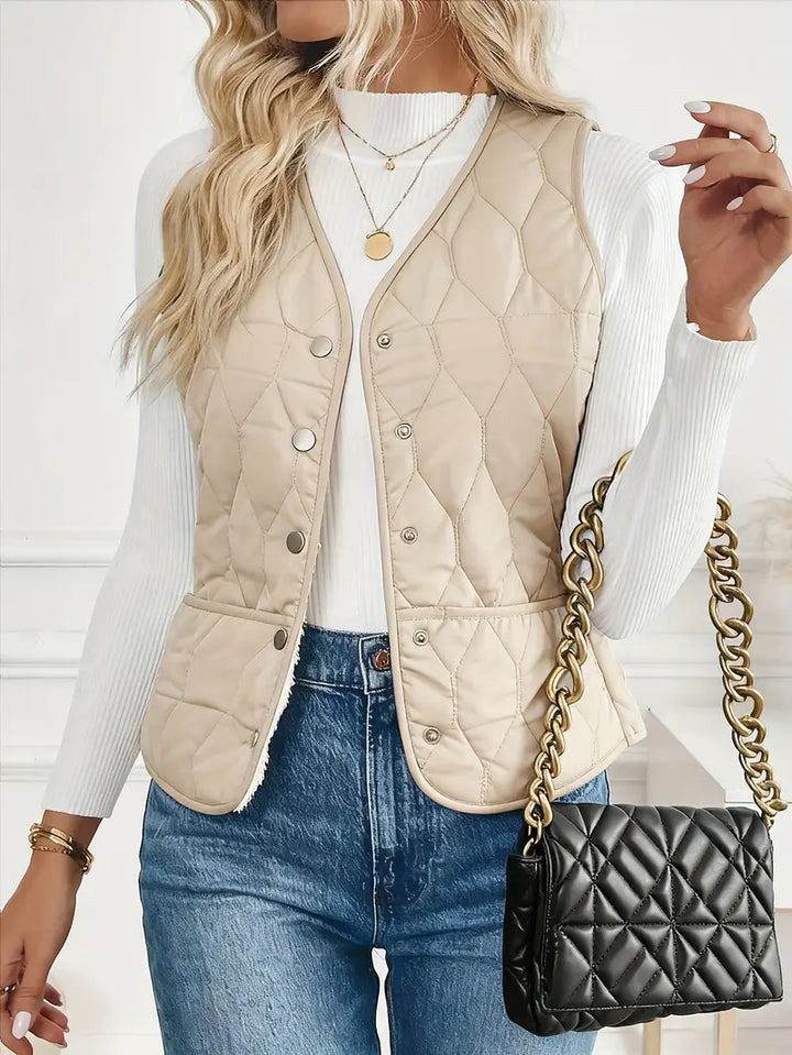 Man in motion, wearing a warm men's quilted bomber vest with sherpa lining. Perfect for active winter layering.