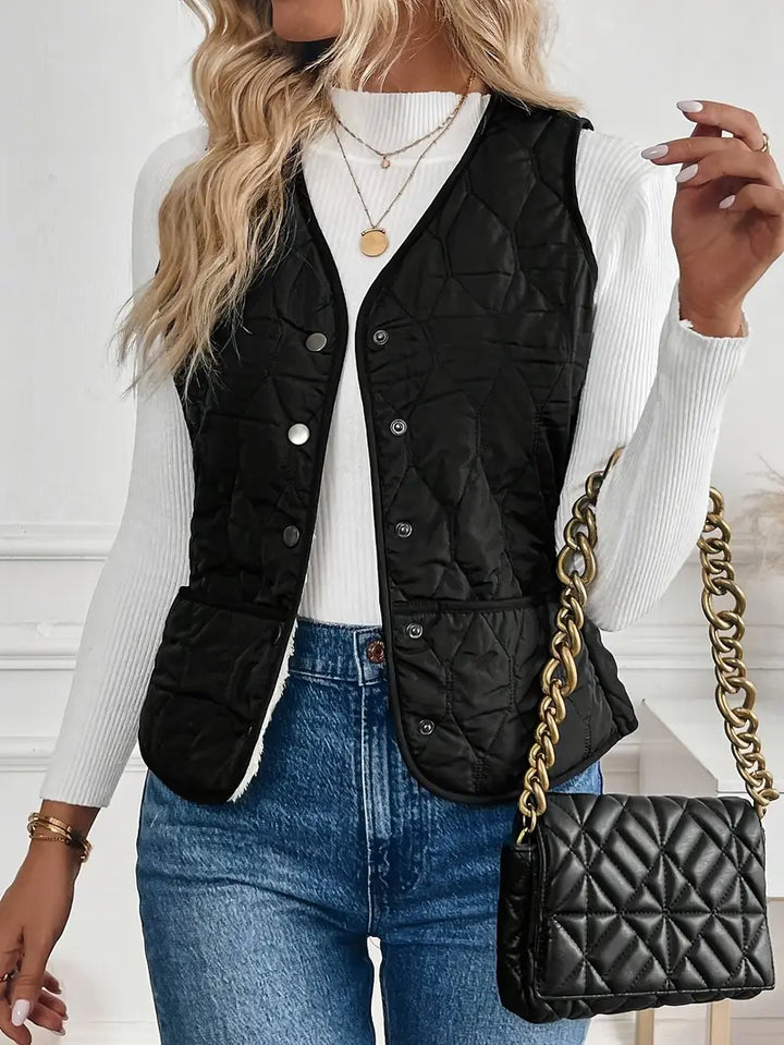 Men's quilted bomber vest with soft sherpa lining displayed flat. Stylish, warm winter outerwear for men.