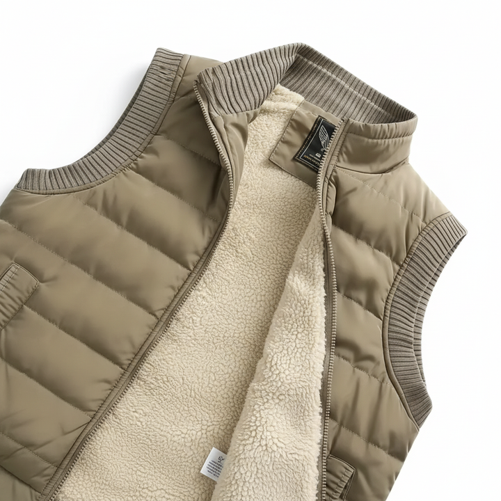 Close-up of a men's black puffer vest with diamond quilting, showing texture and lightweight design