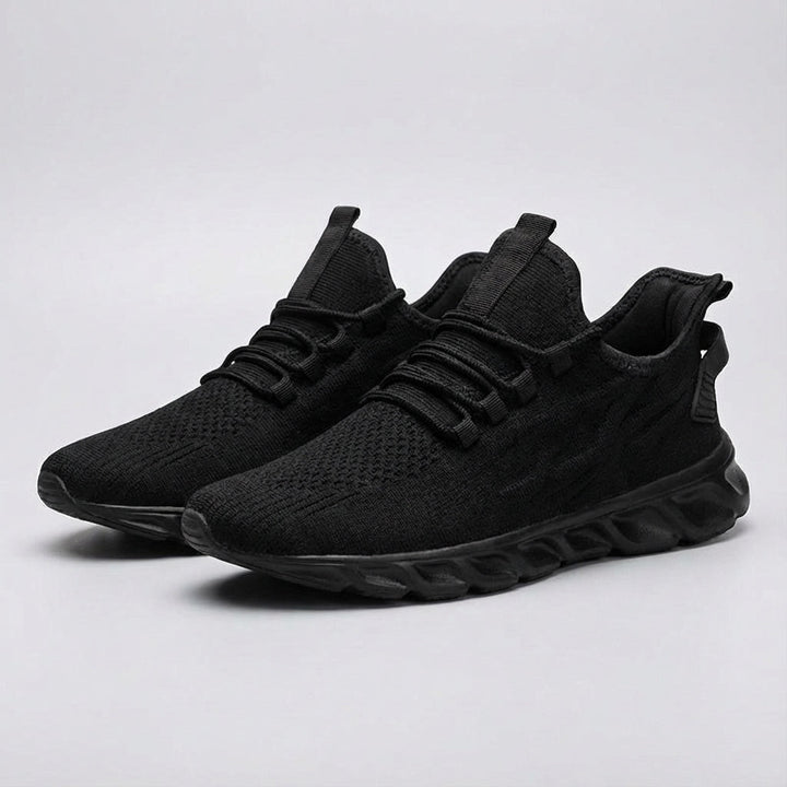 Side view of Randy men's breathable knit athletic sneakers, showcasing their lightweight and comfortable design.