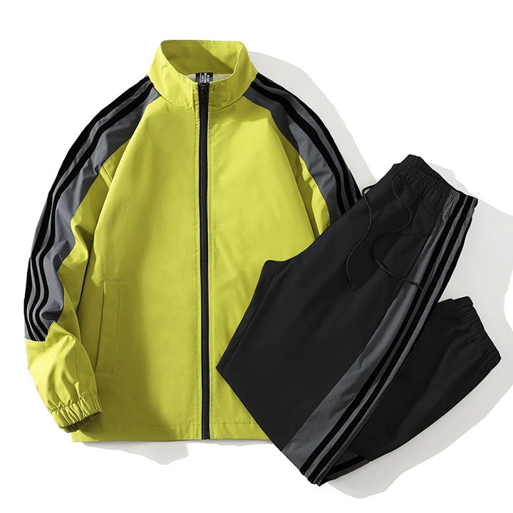Sporty Men's Ravello active tracksuit featuring a stylish colorblock design. Versatile athletic wear for training & casual comfort.