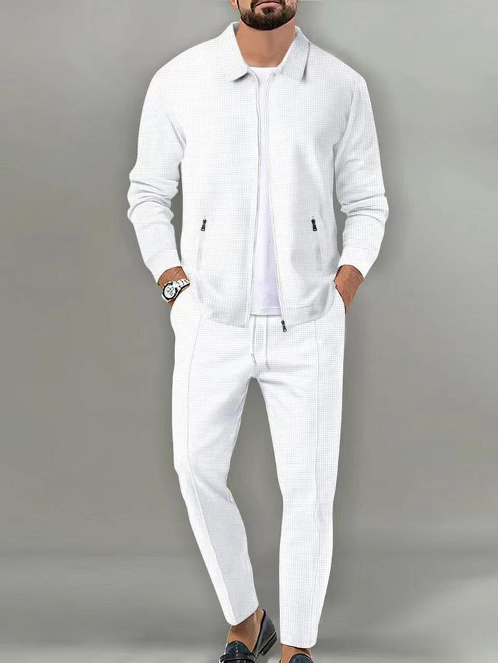 Detail of men's Ravenna zip tracksuit, highlighting refined fabric texture and quality construction for sportswear comfort.
