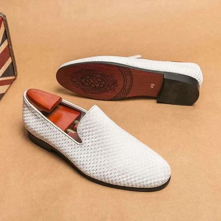 Refined men's black loafers, classic slip-on shoes for office, casual, and elegant events.