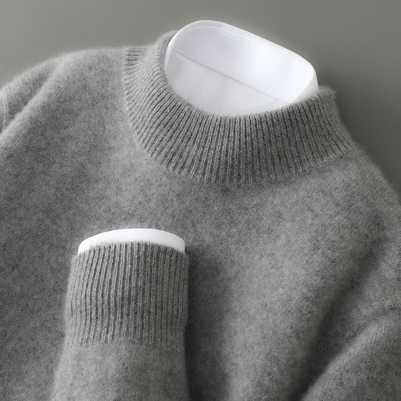 Man models refined pullover sweater for elegant fall/winter fashion. Comfortable menswear style.