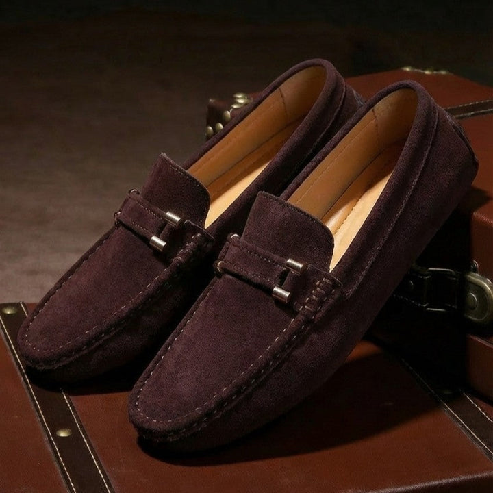 Side view of sleek men's slip-on loafers, ideal for business casual & smart everyday style. Comfortable men's fashion.