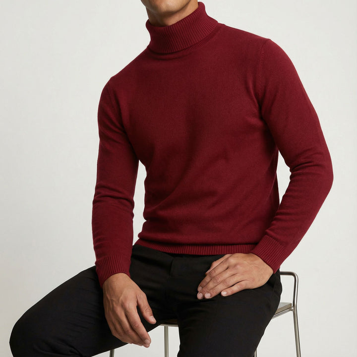 Man in a men's turtleneck at a cafe, displaying versatile and elegant winter fashion.