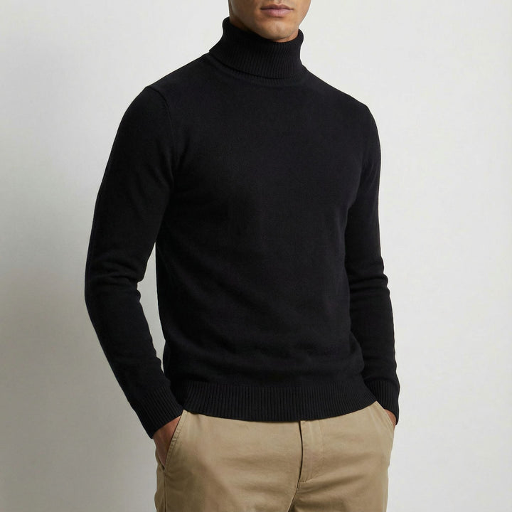 Classic men's black turtleneck, a timeless winter top for refined cold-weather layering.