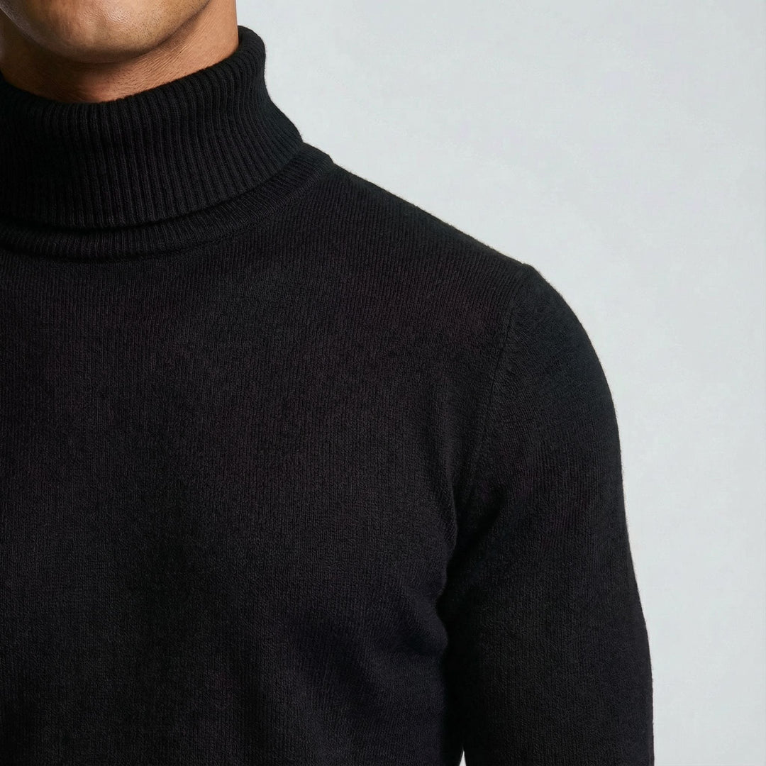 Versatile men's refined turtleneck sweater in deep navy, essential for elegant winter outfits.