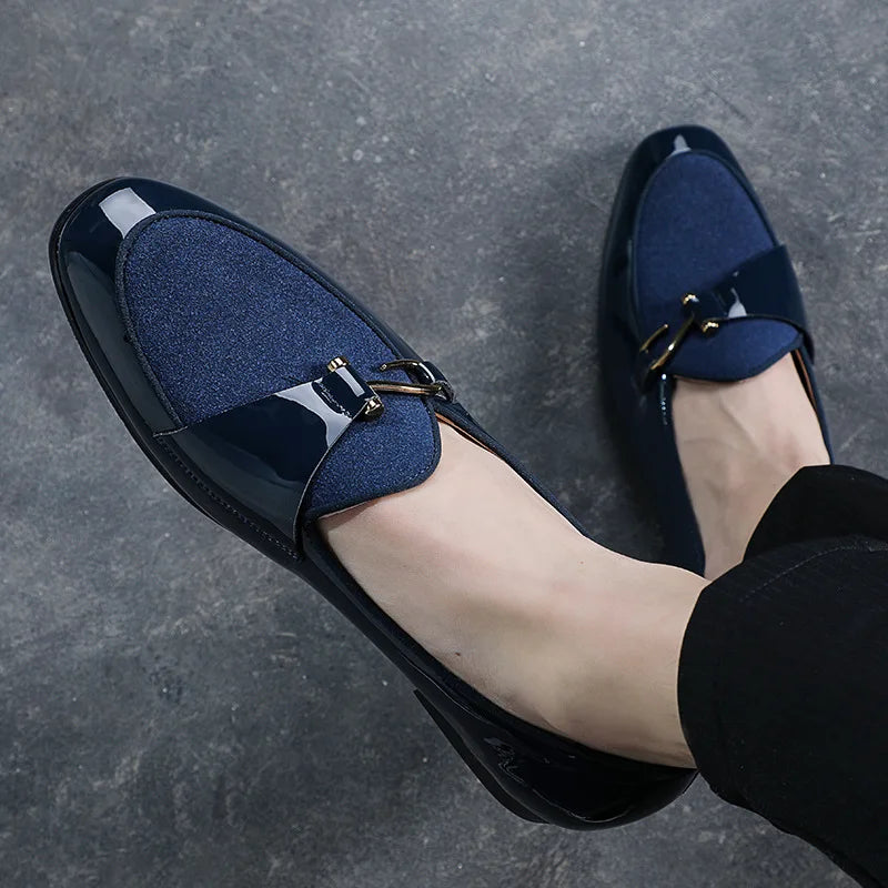 Stylish men's Regal slip-on loafers in premium leather. Ideal classic formal footwear for diverse occasions.
