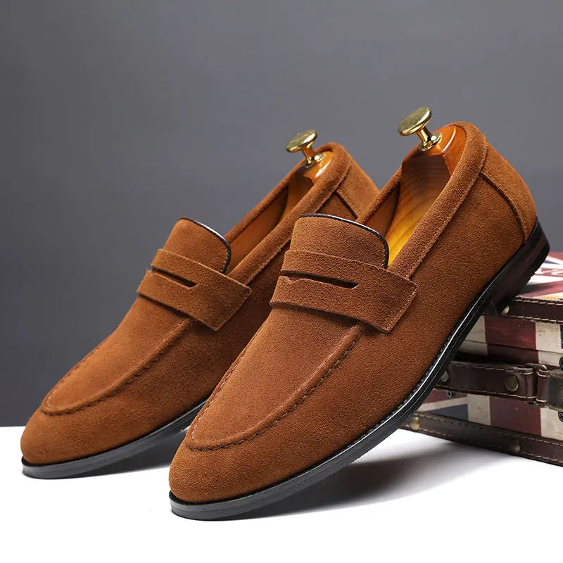 Men's Regal black leather slip-on loafers, ideal for elevated formal and casual style.