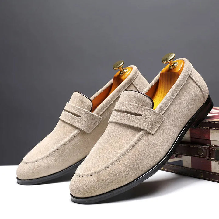 Comfortable men's sleek slip-on loafers in timeless black leather, versatile for formal or casual wear.