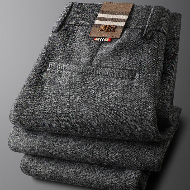 Seated man in Regent tailored trousers, highlighting comfort & sophisticated style for business or casual pants.