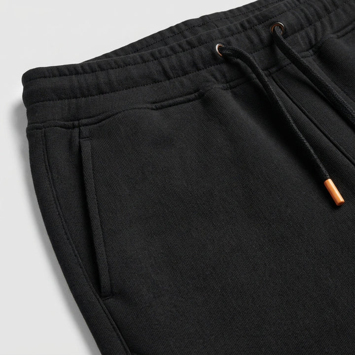 Gray men's regular fit polyester track pants, soft fleece interior for warmth and comfort.