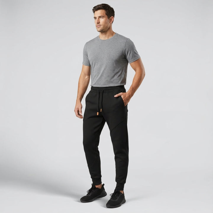 Dark blue men's regular fit athletic jogging pants with elastic waist and cuffs, sportswear.