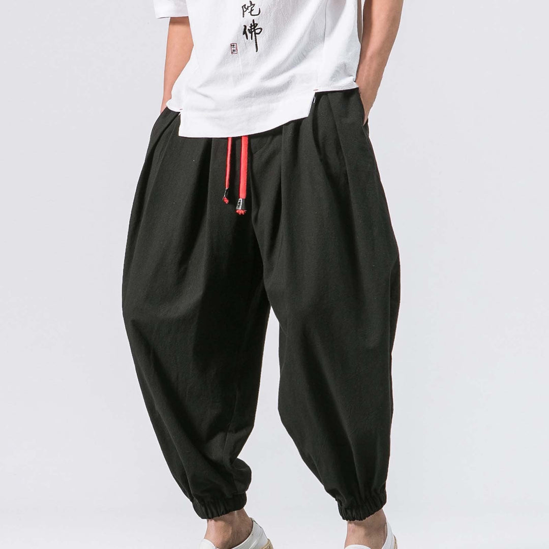 Men's relaxed fit baggy harem joggers, ultimate comfort for casual wear & lounging. Adjustable waist & elastic cuffs.