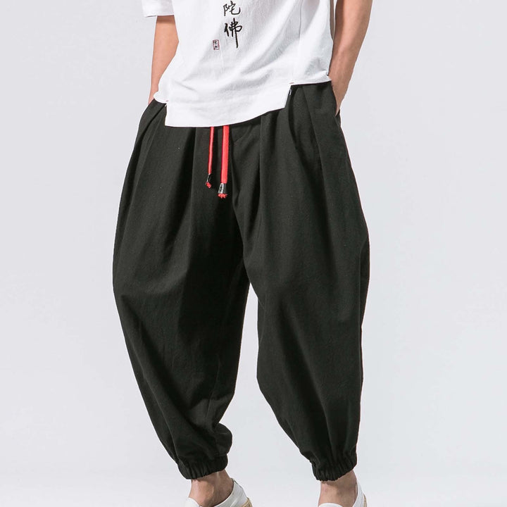 Men's relaxed fit baggy harem joggers, ultimate comfort for casual wear & lounging. Adjustable waist & elastic cuffs.