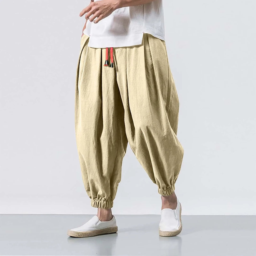 Detail shot of men's baggy harem joggers, highlighting the adjustable waist & comfortable fabric for lounge.