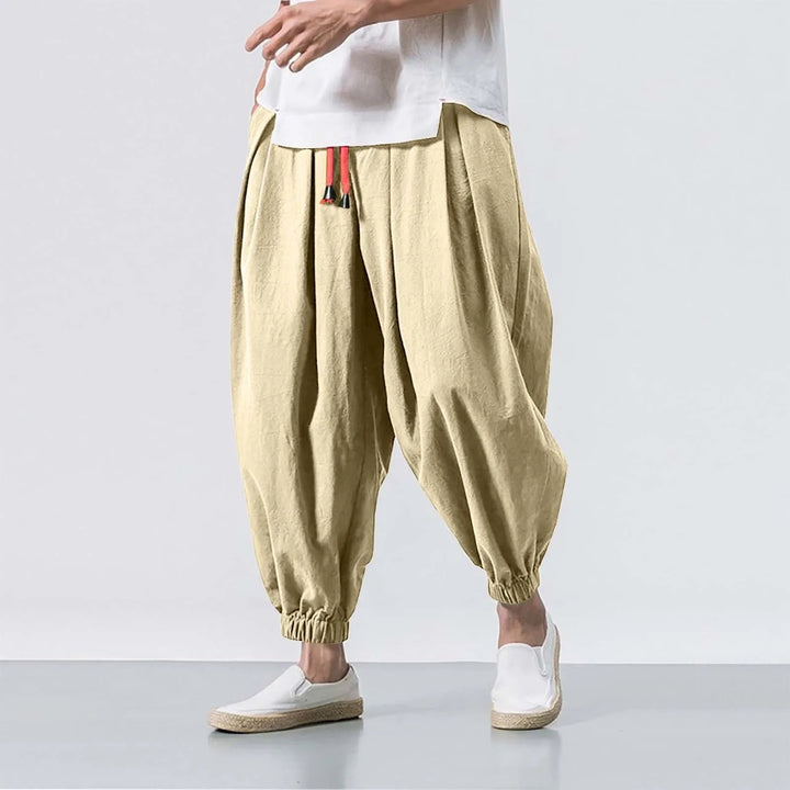 Detail shot of men's baggy harem joggers, highlighting the adjustable waist & comfortable fabric for lounge.