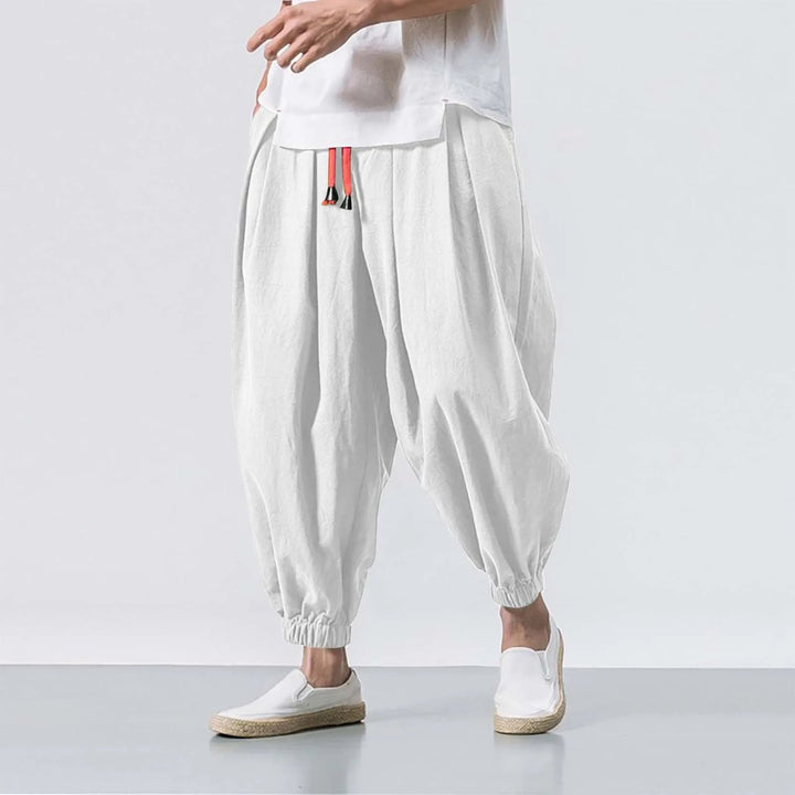 Man wearing relaxed fit baggy harem joggers, demonstrating comfort & style for active or casual daily wear.