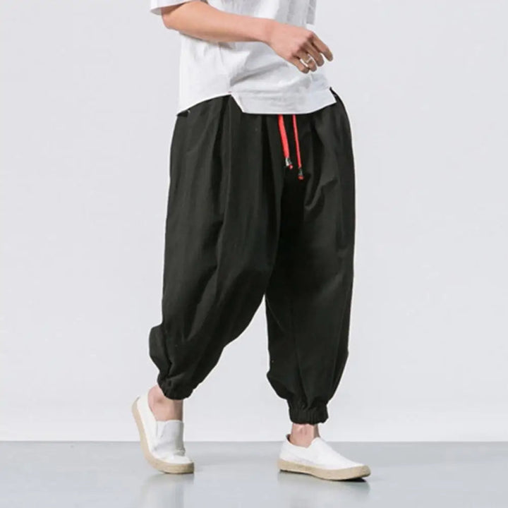 Stylish men's baggy harem joggers with adjustable waist, perfect for ultimate comfort & relaxed athleisure wear.