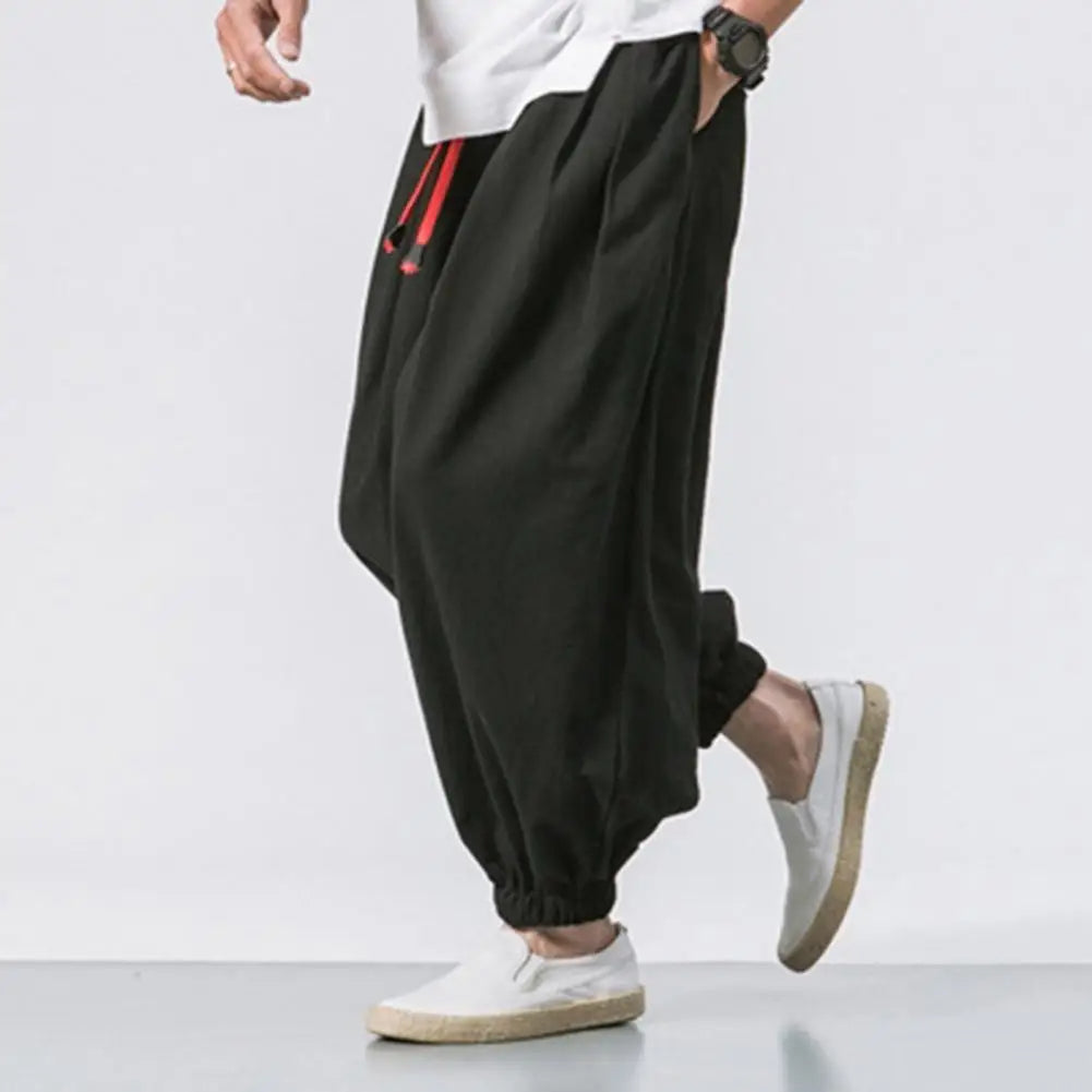 Comfortable men's relaxed fit joggers featuring elastic cuffs, ideal for activewear, yoga, or everyday casual style.