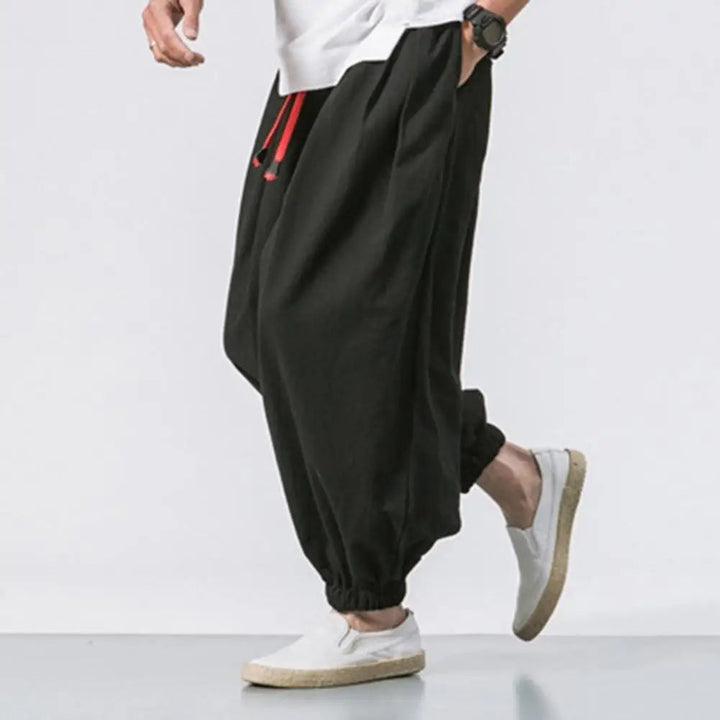 Comfortable men's relaxed fit joggers featuring elastic cuffs, ideal for activewear, yoga, or everyday casual style.