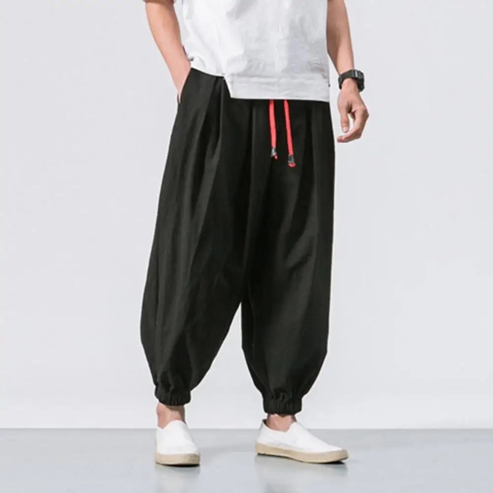 Versatile men's lounge pants; baggy harem design offers supreme comfort for relaxing at home or casual outings.