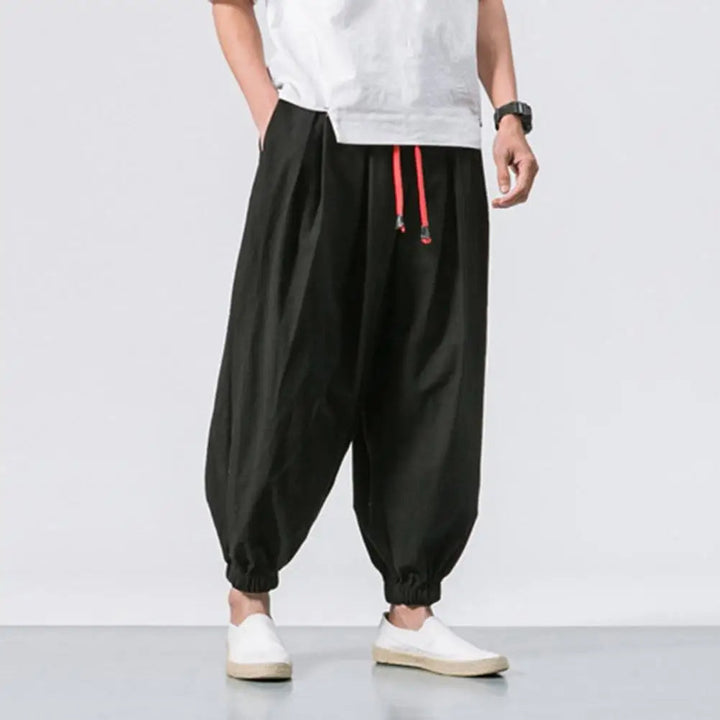 Versatile men's lounge pants; baggy harem design offers supreme comfort for relaxing at home or casual outings.