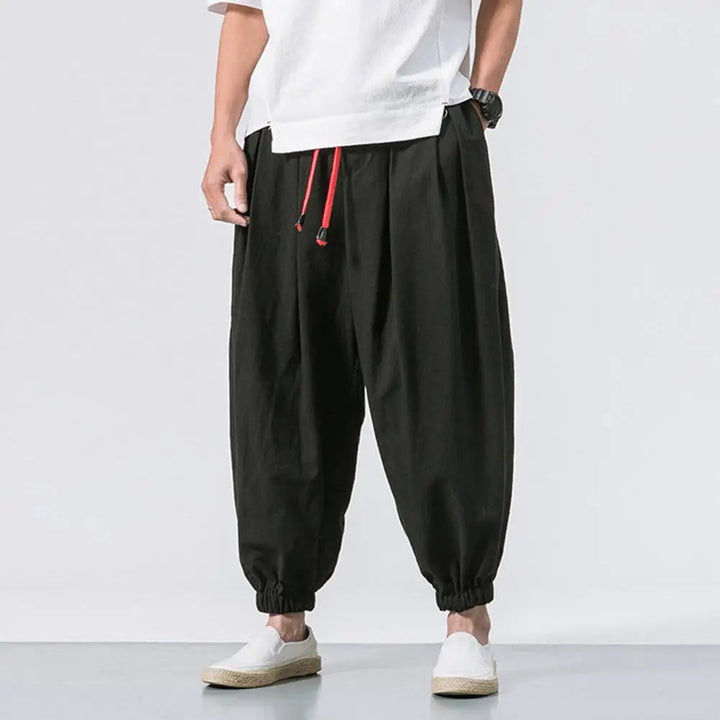 Black men's activewear joggers, a relaxed baggy fit harem style for freedom of movement & ultimate comfort.