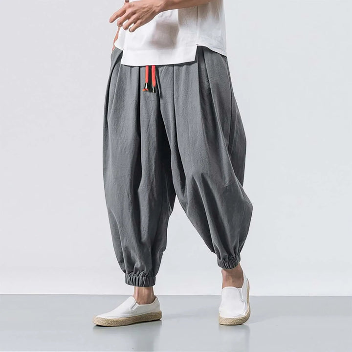 Full view of men's relaxed fit baggy harem joggers, showcasing the comfortable design & elastic cuffs.
