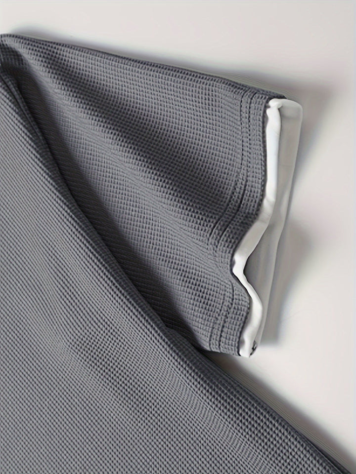 Men's everyday textured grey lounge set. Two-piece comfortable T-shirt and drawstring shorts, ideal for relaxed wear.