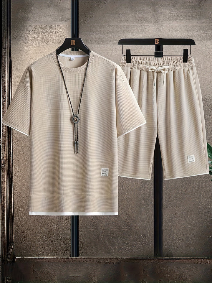 Men's comfortable beige casual wear. Relaxed fit textured lounge T-shirt and matching drawstring shorts set.