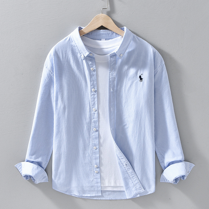 Men's relaxed fit blue button-front shirt, long sleeve, for casual everyday wear. Versatile classic style.