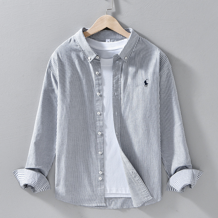 Classic men's relaxed fit long sleeve button-front shirt in a stylish blue, ideal for casual comfort.