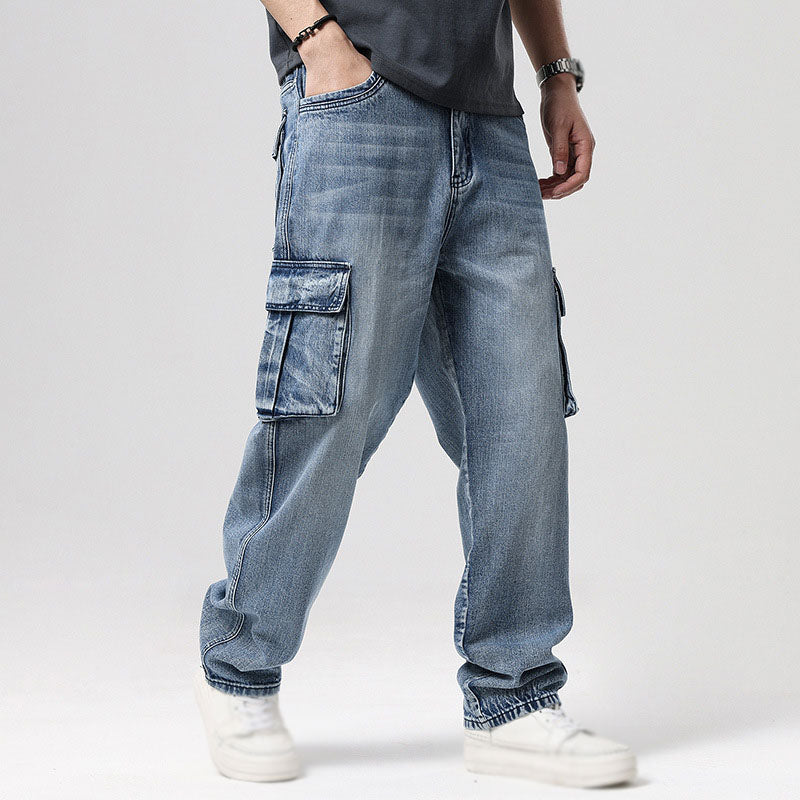 Stylish faded blue men's relaxed fit cargo jeans, a key piece for modern men's casual apparel.