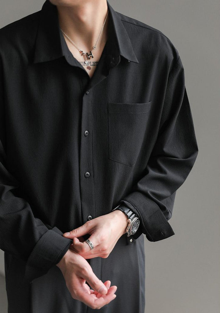 Men's relaxed fit long-sleeve button-up shirt styled for a smart casual look, highlighting its versatile comfort.