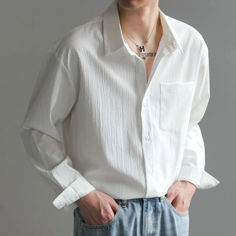 Front view of man in a stylish, casual men's relaxed fit long-sleeve button-up shirt for versatile everyday fashion.