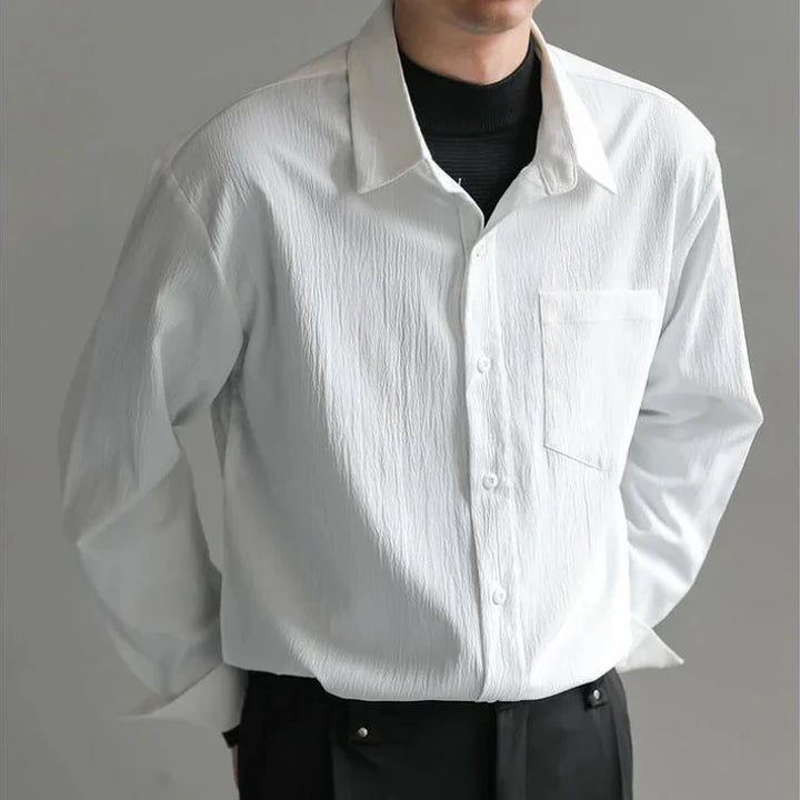 Back view of men's relaxed fit button-up shirt, showcasing the comfortable cut and long sleeves. Everyday fashion.
