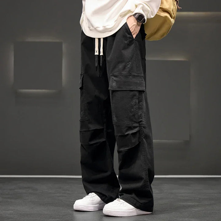 Men's relaxed fit cargo pants in a neutral color, comfortable and functional for everyday wear.