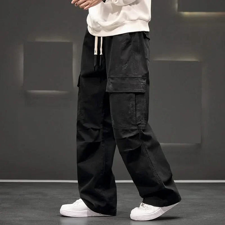Khaki men's relaxed fit cargo pants, ideal for casual wear, featuring a drawstring waist & practical multi-pockets.