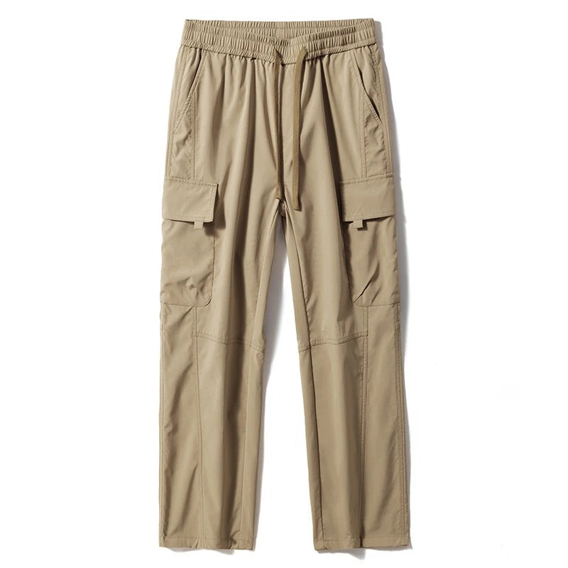 Close-up: Durable fabric of men's relaxed fit cargo pants, showing utility pockets and comfortable weave for casual use.