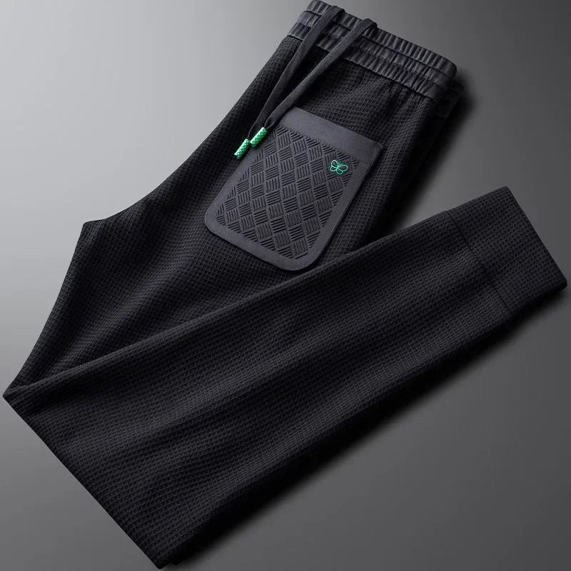 Crisp white men's relaxed fit casual pants, offering a stylish and comfortable modern fit.