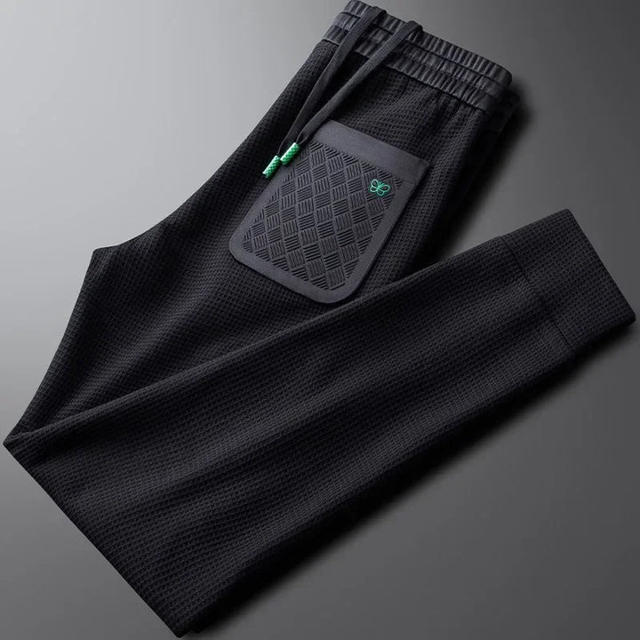 Crisp white men's relaxed fit casual pants, offering a stylish and comfortable modern fit.